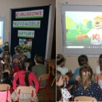 Dzieci oglądają film edukacyjny na tablicy interaktywnej
