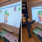 Chłopiec układa puzzle na tablicy interaktywnej