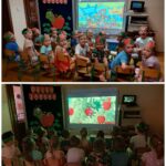 Dzieci oglądają film edukacyjny o jabłkach