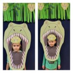 Chłopiec z dziewczynką w paszczy dinozaura