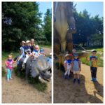 Dzieci z oddziału Żuczki przy figurach dinozaurów