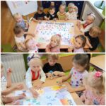 Przedszkolaki z oddziału Żuczki przyklejają kropki na wspólnym platacie
