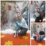 Rodzice z dziećmi przy świątecznej ściance