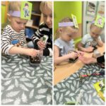 Dziewczynka i chłopiec z oddziału Żuczki wkładają nasiona do ziemi