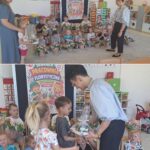 Przedszkolaki wręczają podziękowanie florystce